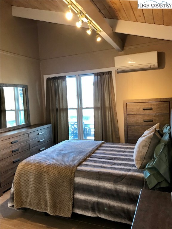 104 Pine Ridge Road Beech Mountain, NC 28604 - Photo 16 of 25 a bedroom with a bed and a dresser