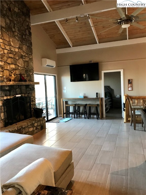 104 Pine Ridge Road Beech Mountain, NC 28604 - Photo 10 of 25 a lobby with furniture and a floor to ceiling window