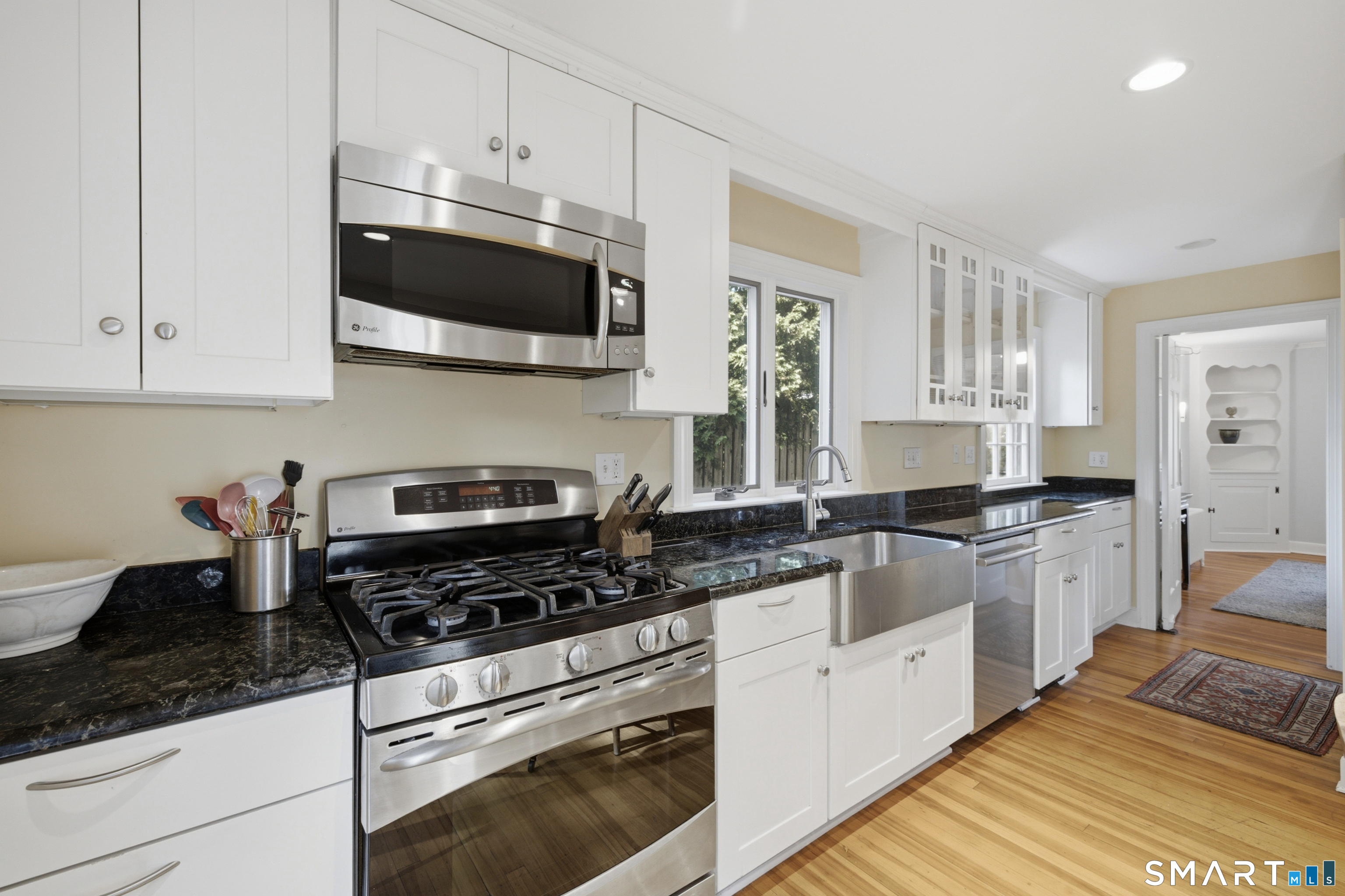 9 Stratford Road West Hartford, CT 06117 - Photo 13 of 40 A beautifully updated kitchen offers granite countertops, stainless steel appliances, hardwood flooring