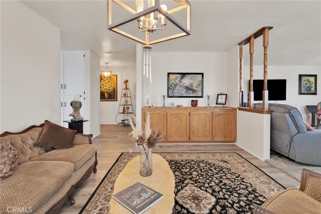 21291 Ramona Road Apple Valley, CA 92307 - Photo 11 of 35 a living room with furniture and a rug