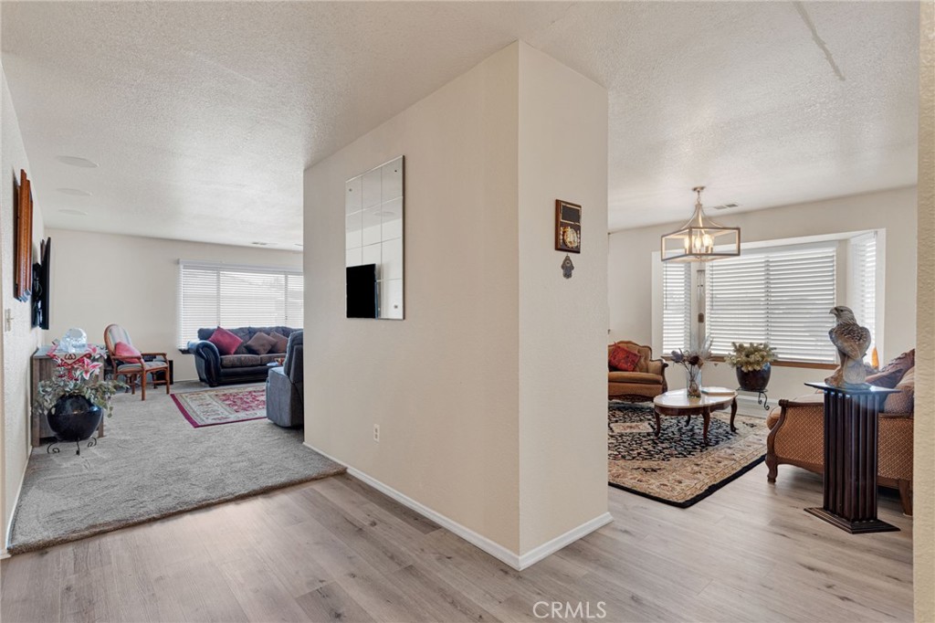 21291 Ramona Road Apple Valley, CA 92307 - Photo 13 of 35 a living room with furniture and a wooden floor