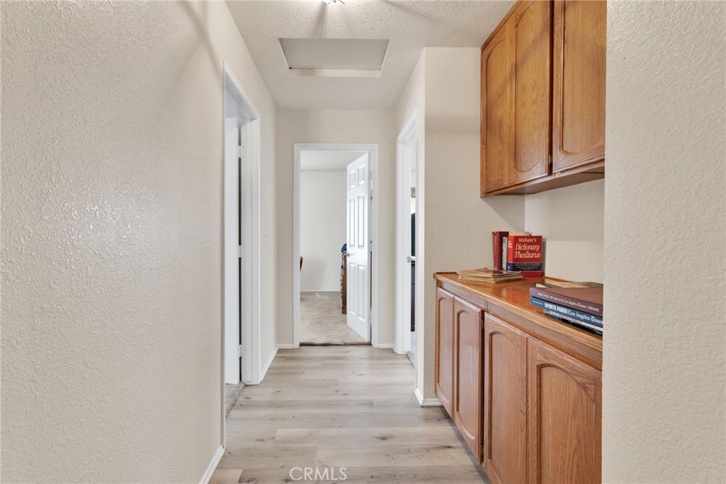 21291 Ramona Road Apple Valley, CA 92307 - Photo 22 of 35 a kitchen with cabinets and a stove