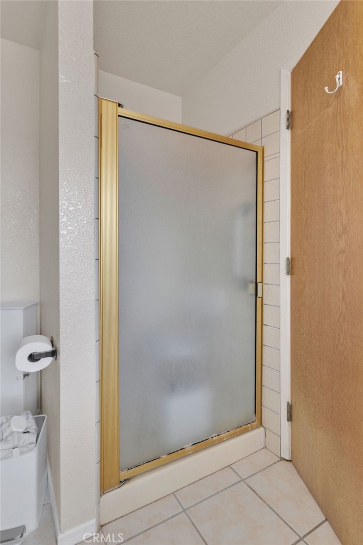 21291 Ramona Road Apple Valley, CA 92307 - Photo 28 of 35 a bathroom with a shower and a toilet