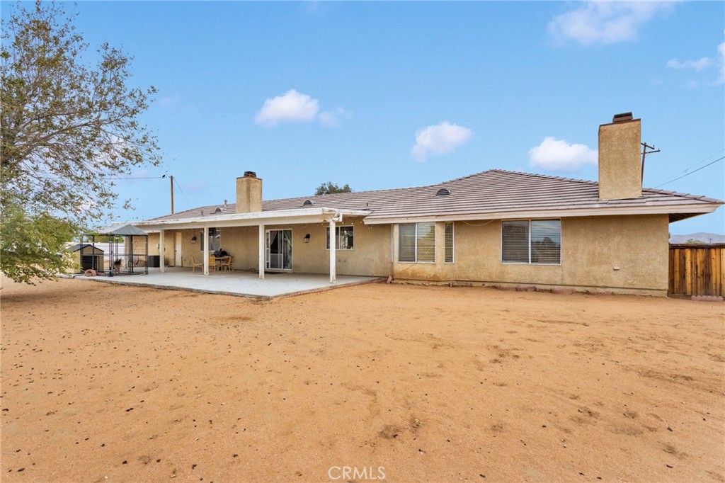21291 Ramona Road Apple Valley, CA 92307 - Photo 30 of 35 a front view of a house with a yard