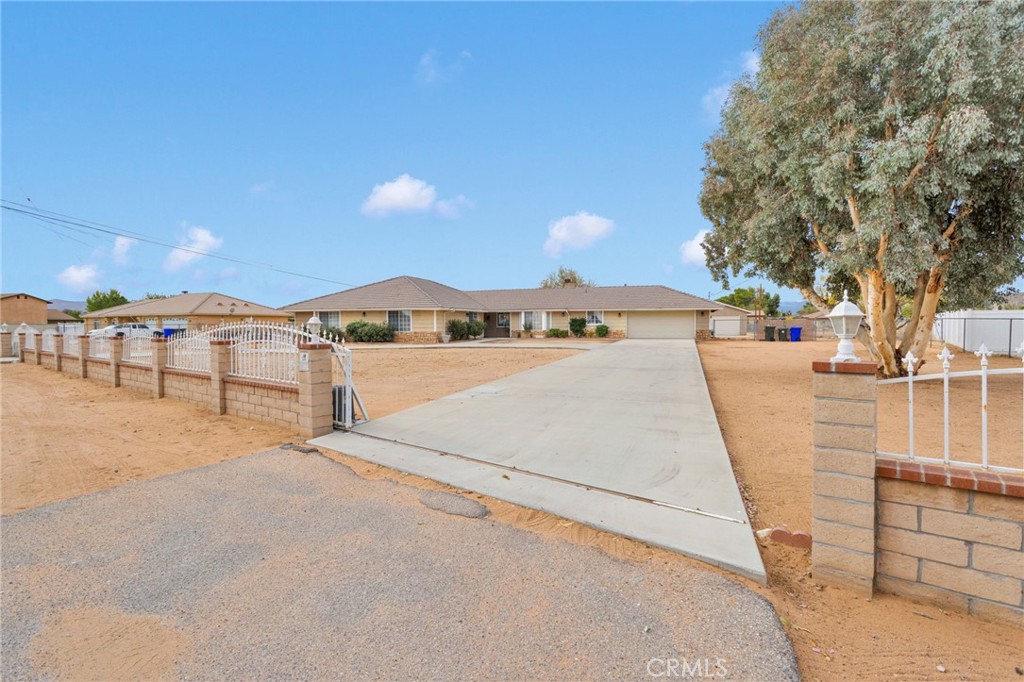 21291 Ramona Road Apple Valley, CA 92307 - Photo 3 of 35 a view of a parking space with a sink