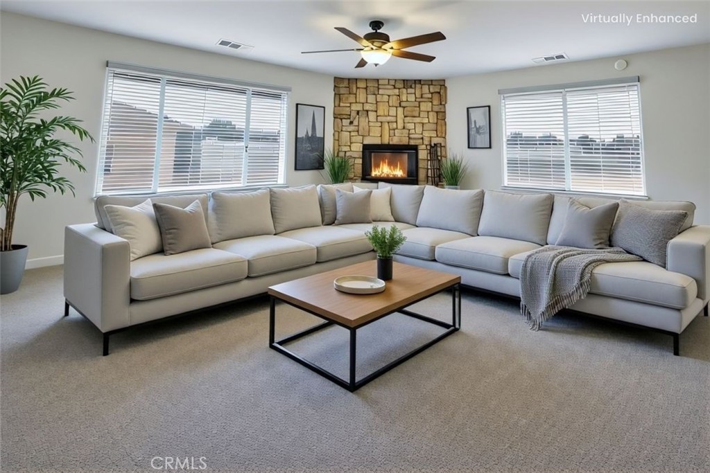 21291 Ramona Road Apple Valley, CA 92307 - Photo 6 of 35 a living room with furniture and a large window