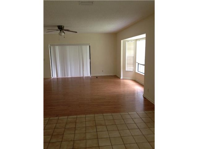 13188 Sand Ridge Road Palm Beach Gardens, FL 33418 - Photo 6 of 7 a view of a livingroom with a window