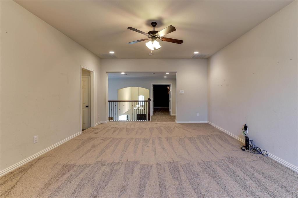 419 Rio Grande Drive Irving, TX 75039 - Photo 25 of 29 Spacious room featuring neutral carpeting and light-colored walls