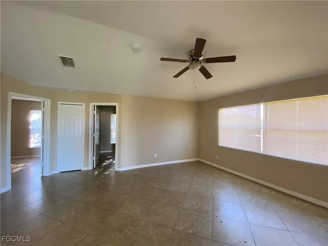 a view of an empty room and window