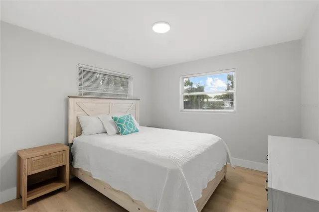 a bedroom with a bed and a couch