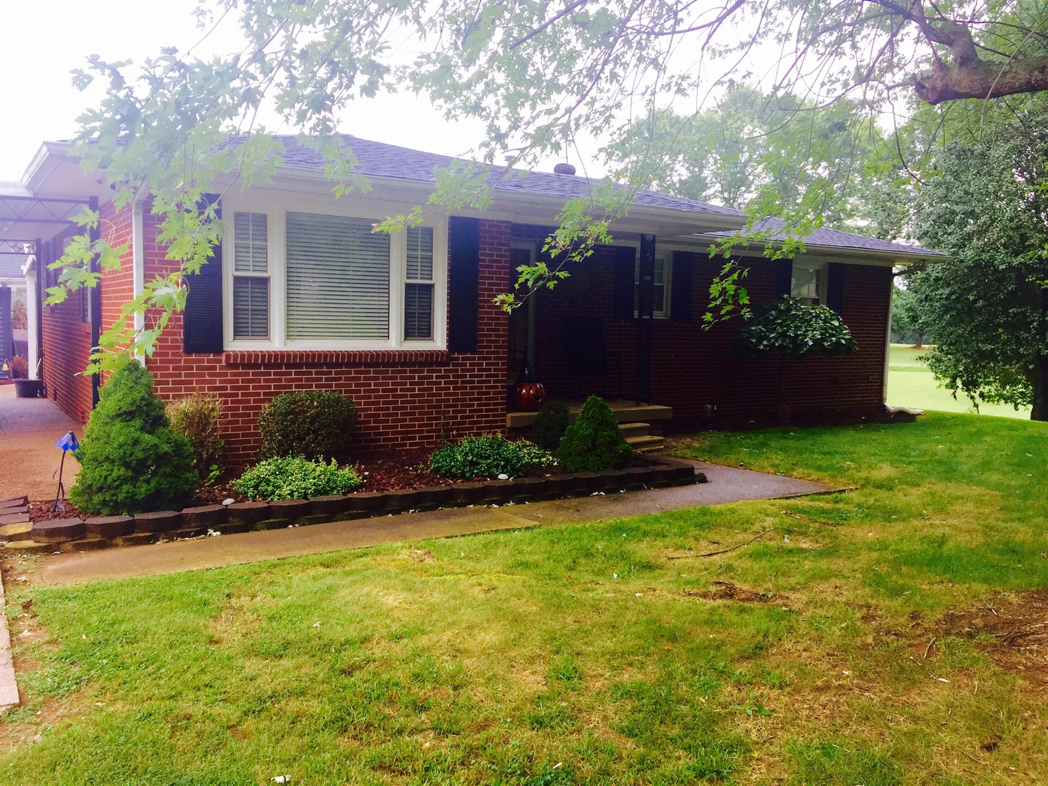 8026 Cedar Grove Road Cross Plains, TN 37049 - Photo 3 of 30 a front view of a house with garden