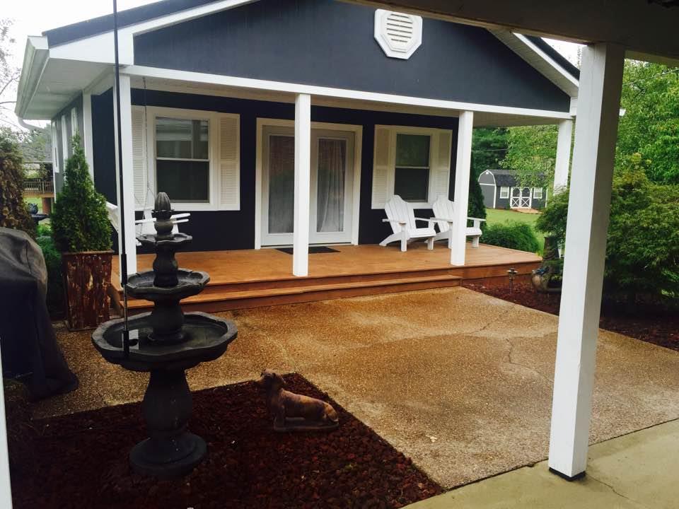 8026 Cedar Grove Road Cross Plains, TN 37049 - Photo 21 of 30 a view of a patio with table and chairs potted plants with wooden floor