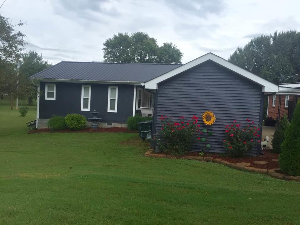 8026 Cedar Grove Road Cross Plains, TN 37049 - Photo 22 of 30 a view of a house with a yard