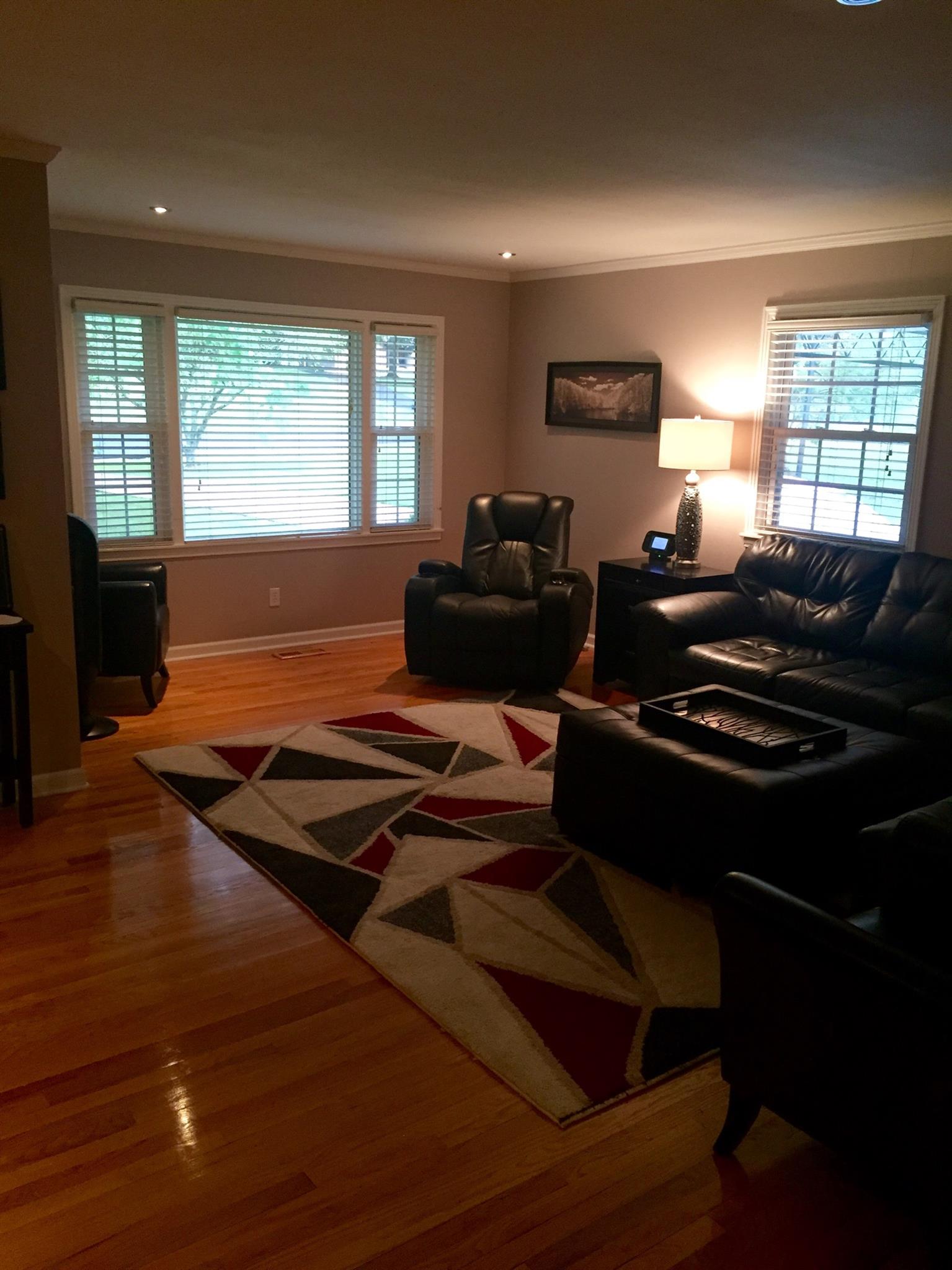 8026 Cedar Grove Road Cross Plains, TN 37049 - Photo 9 of 30 a living room with furniture flat screen tv and a large window