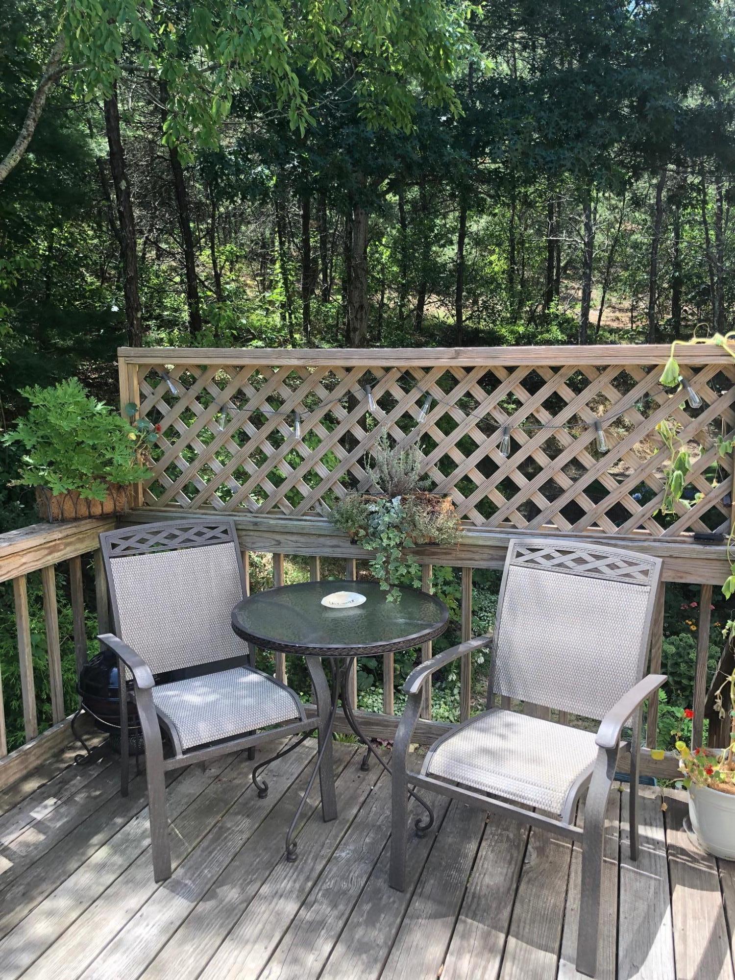 46-a B Standish Road Sagamore Beach, MA 02562 - Photo 12 of 31 a view of a chairs and table in backyard