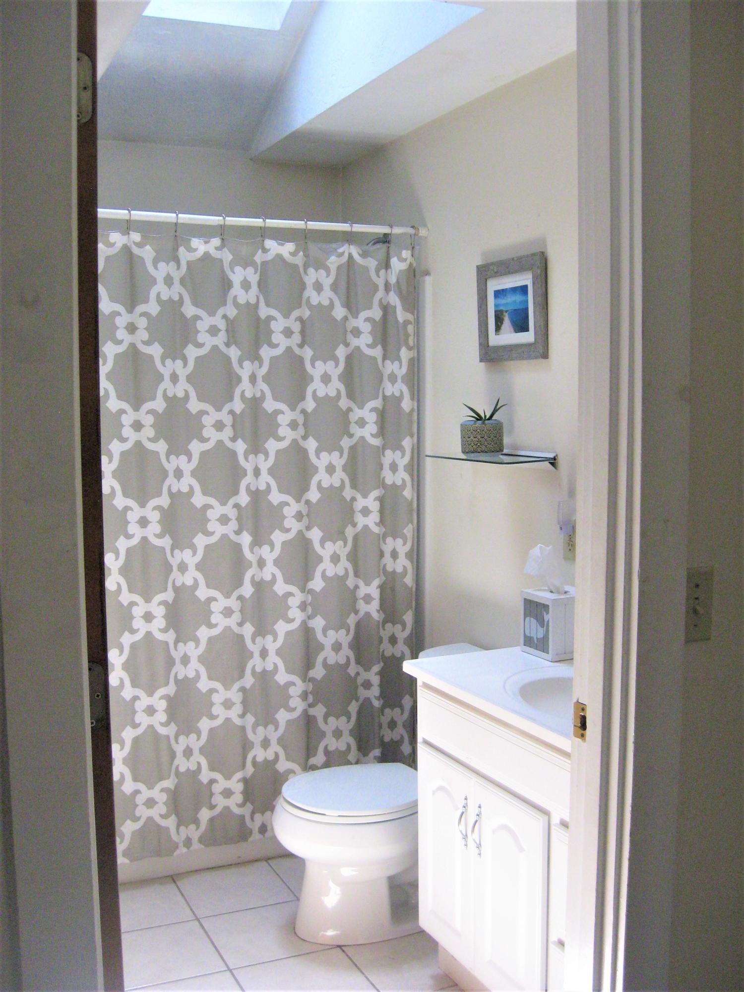 46-a B Standish Road Sagamore Beach, MA 02562 - Photo 16 of 31 a bathroom with a granite countertop toilet and a sink