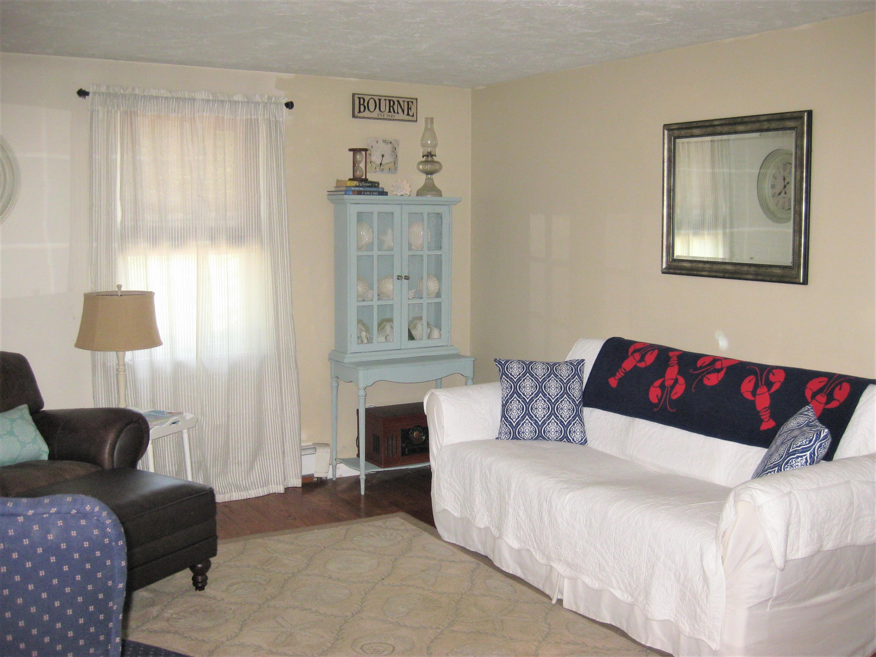 46-a B Standish Road Sagamore Beach, MA 02562 - Photo 6 of 31 a living room with furniture and a window