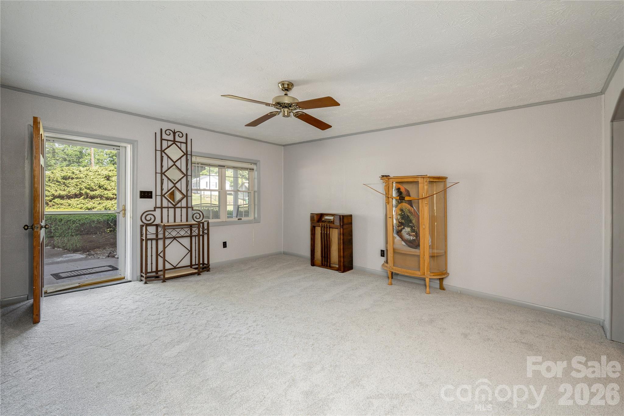 231 Allen Road East Flat Rock, NC 28726 - Photo 5 of 42 a view of an empty room with a window