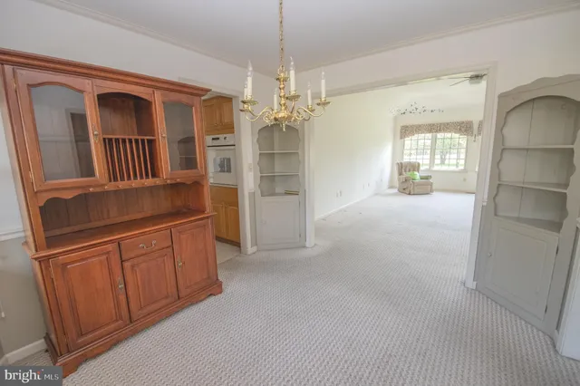 a view of a kitchen with a refrigerator and a sink