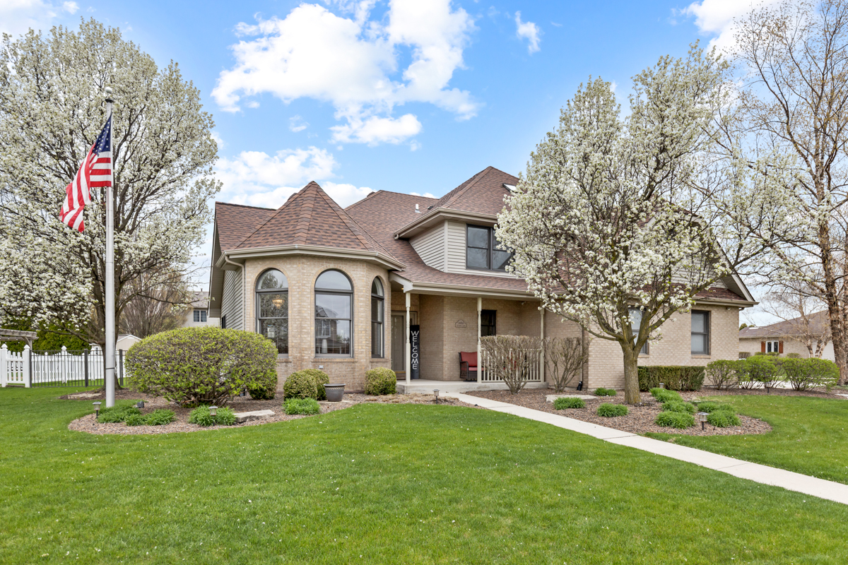 24854 Buttercup Lane Manhattan, IL 60442 - Photo 1 of 36 a front view of a house with a garden