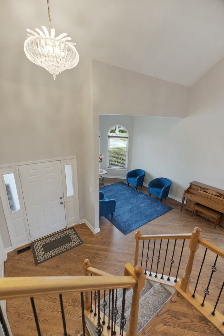 24854 Buttercup Lane Manhattan, IL 60442 - Photo 11 of 36 a bedroom with furniture and wooden floor