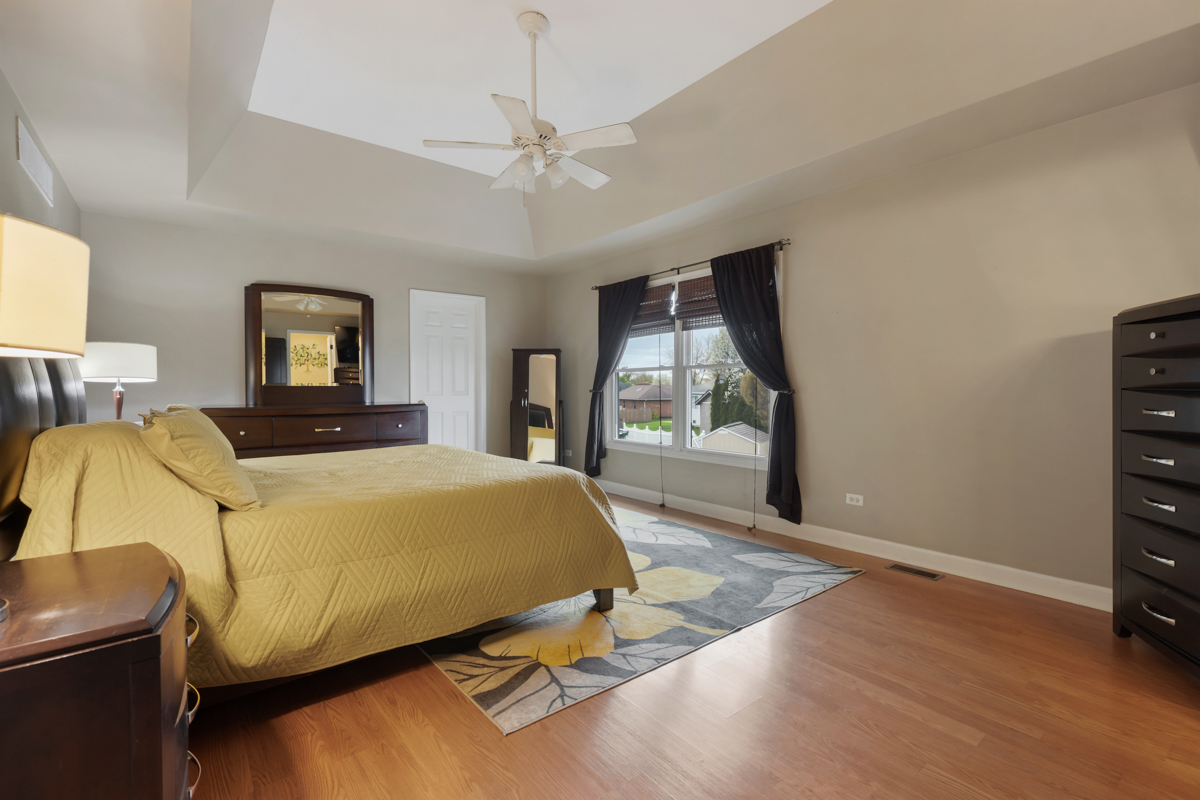 24854 Buttercup Lane Manhattan, IL 60442 - Photo 18 of 36 a bedroom with a bed and window