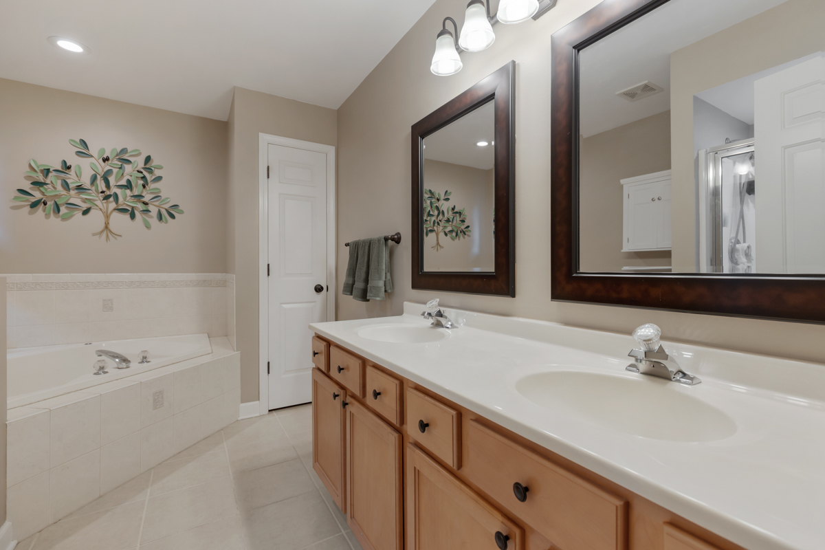 24854 Buttercup Lane Manhattan, IL 60442 - Photo 20 of 36 a bathroom with a double vanity sink mirror double and bathtub