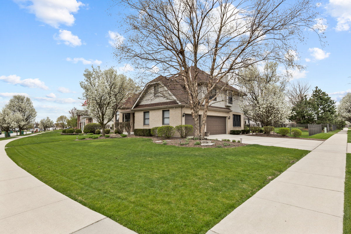 24854 Buttercup Lane Manhattan, IL 60442 - Photo 2 of 36 a front view of a house with garden