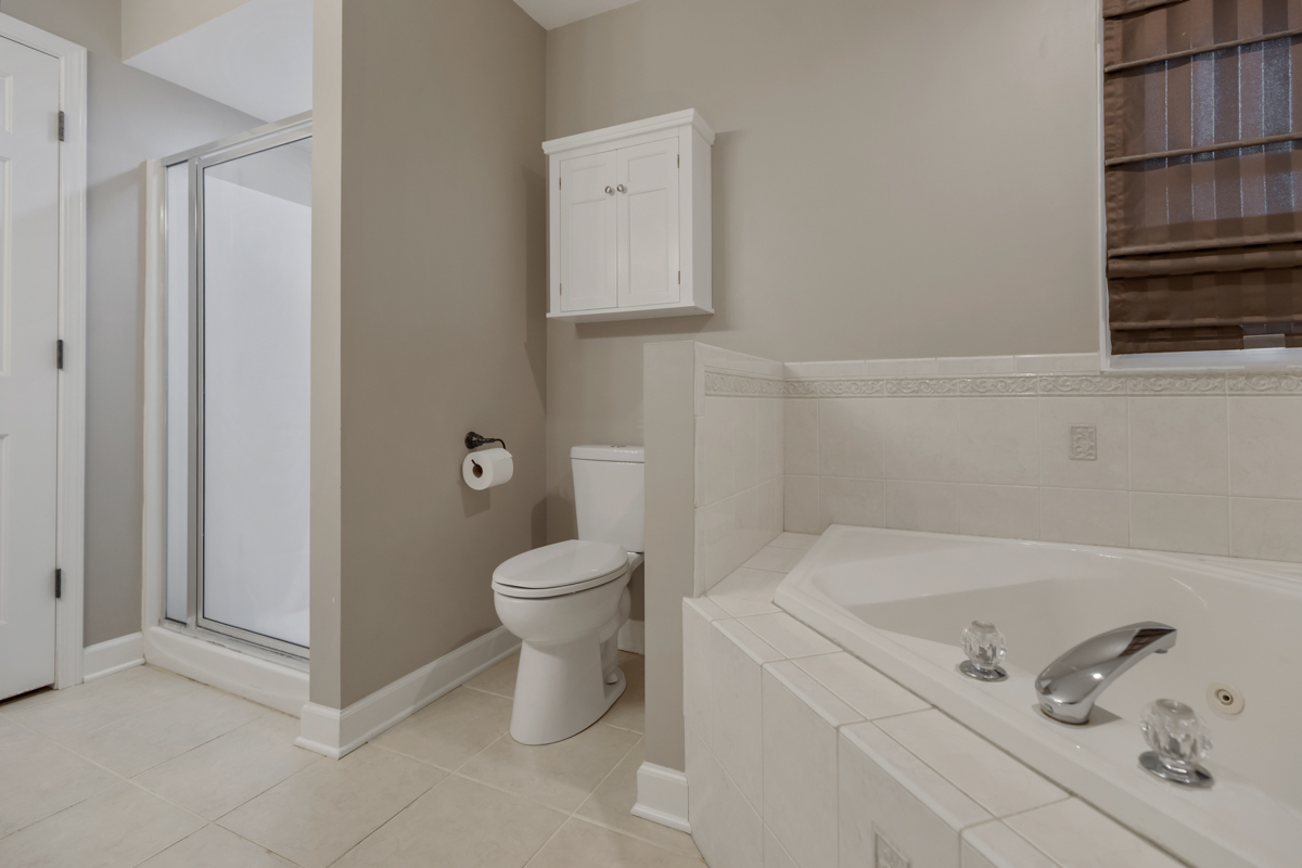 24854 Buttercup Lane Manhattan, IL 60442 - Photo 21 of 36 a bathroom with a toilet and a sink