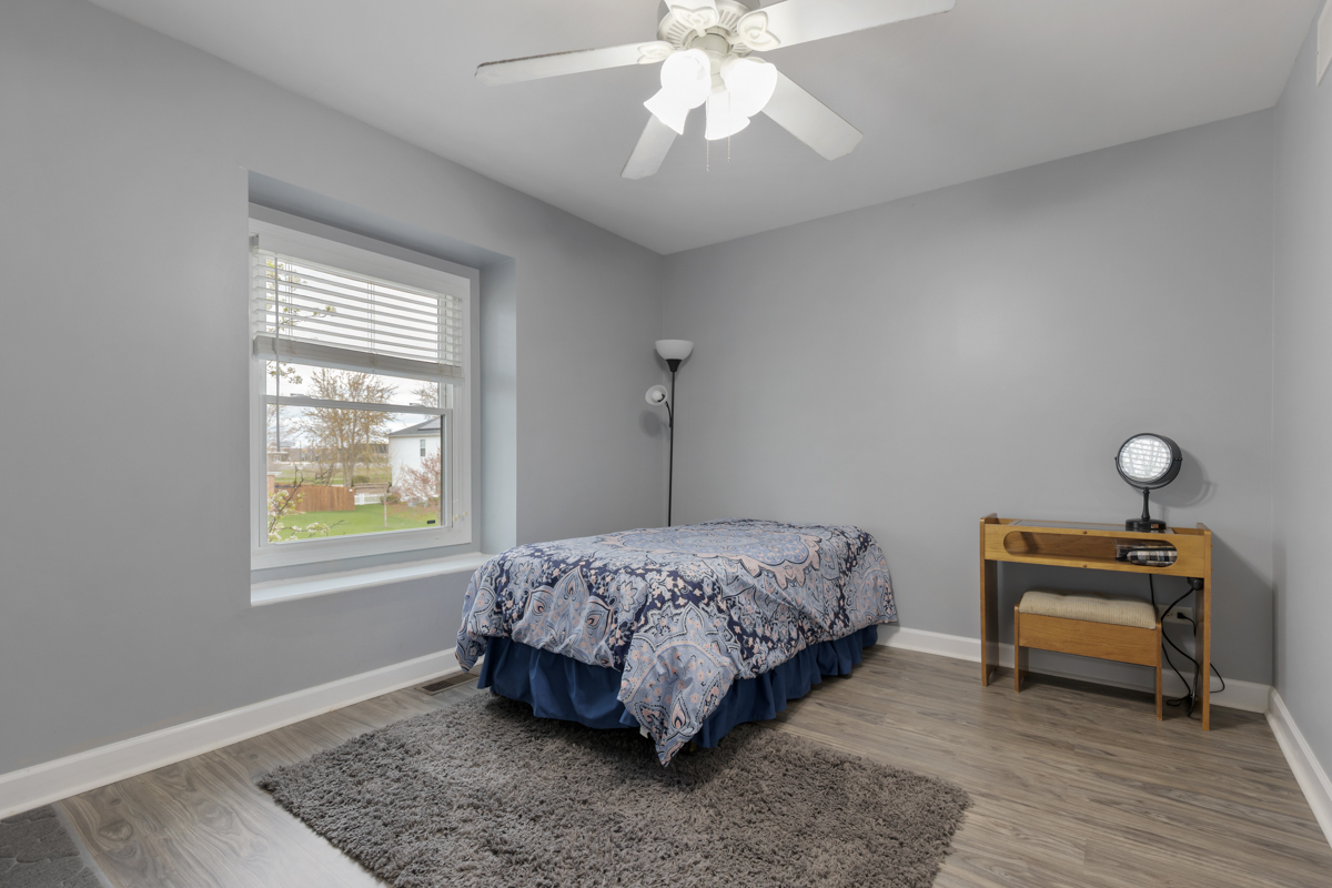 24854 Buttercup Lane Manhattan, IL 60442 - Photo 22 of 36 a bedroom with bed and a window