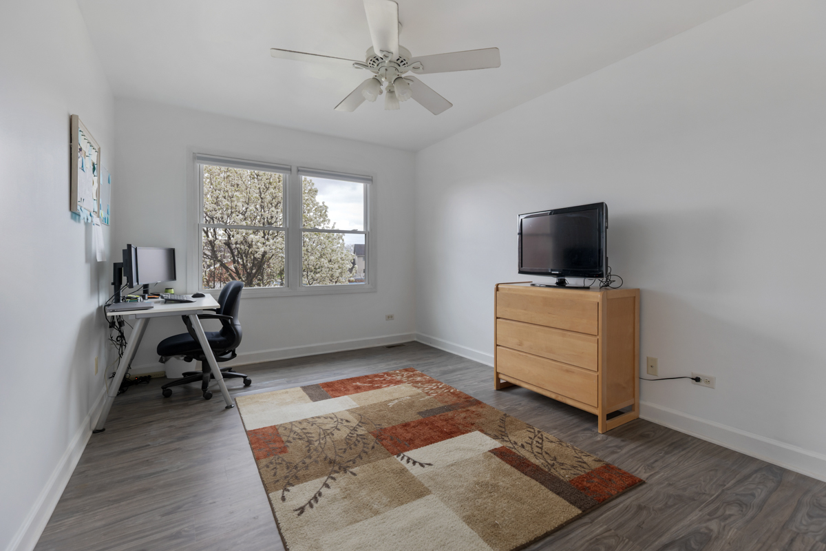 24854 Buttercup Lane Manhattan, IL 60442 - Photo 25 of 36 a view of a workspace with furniture and a window