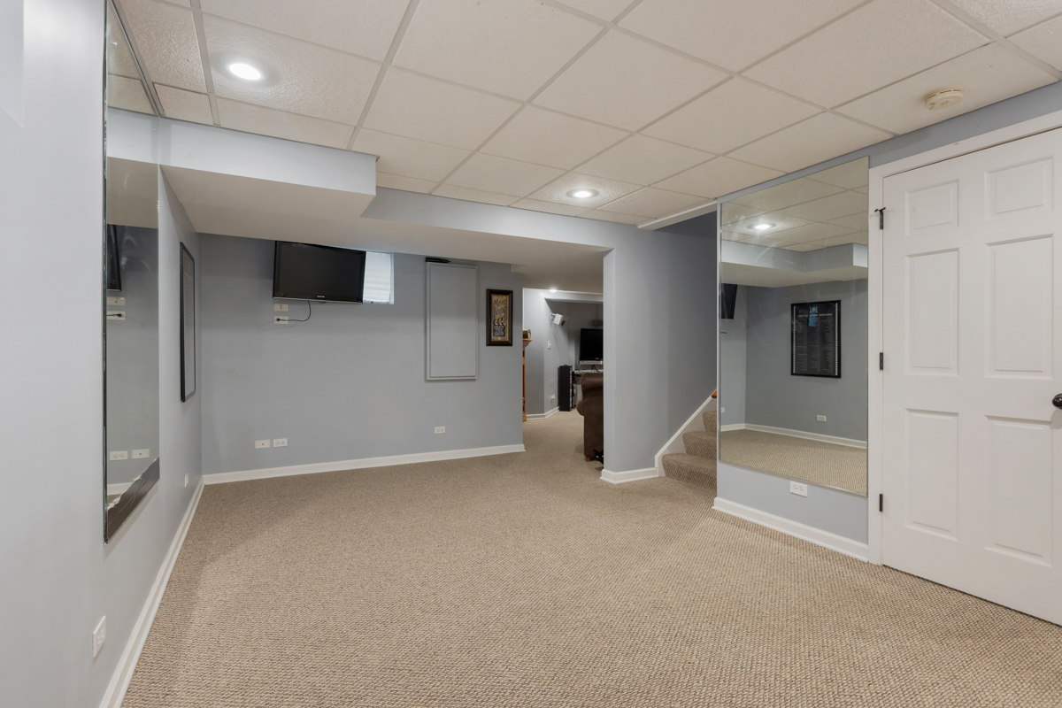 24854 Buttercup Lane Manhattan, IL 60442 - Photo 26 of 36 a view of a livingroom with a refrigerator