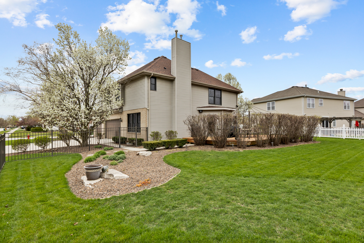 24854 Buttercup Lane Manhattan, IL 60442 - Photo 33 of 36 a view of a house with backyard and a tree