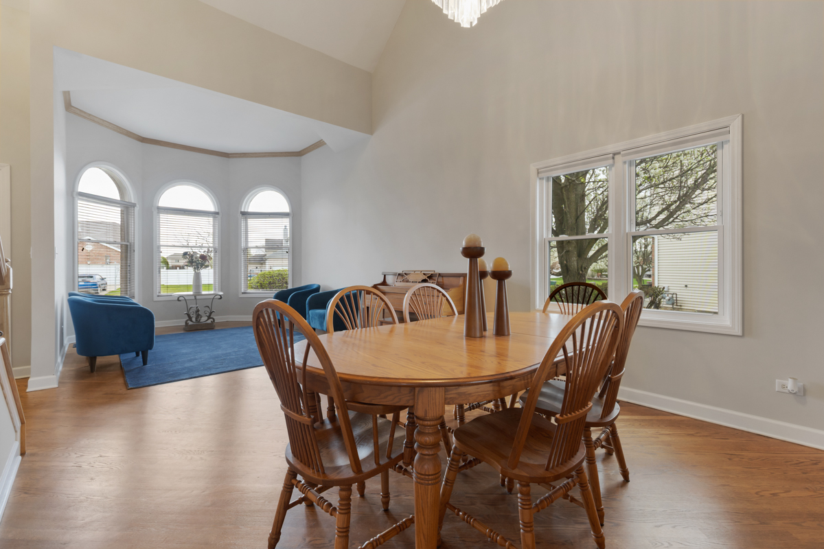 24854 Buttercup Lane Manhattan, IL 60442 - Photo 8 of 36 a view of a dining room with furniture and wooden floor