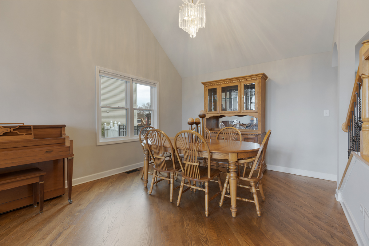 24854 Buttercup Lane Manhattan, IL 60442 - Photo 9 of 36 a view of a dining room with furniture and wooden floor