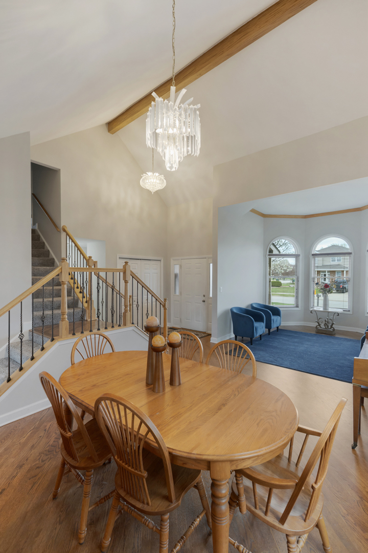 24854 Buttercup Lane Manhattan, IL 60442 - Photo 10 of 36 a view of a dining room with furniture and wooden floor