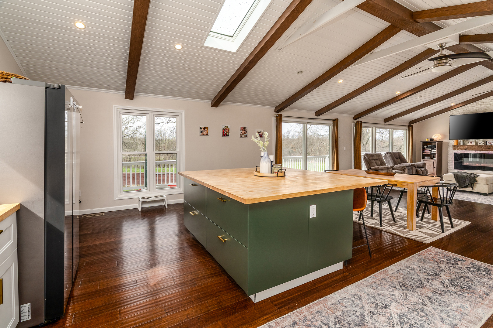 2930 Campground Road Anna, IL 62906 - Photo 39 of 81 a kitchen with stainless steel appliances granite countertop a refrigerator a sink dishwasher a stove and a dining table with wooden floor
