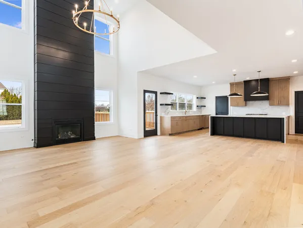 a large kitchen with a stove and a refrigerator
