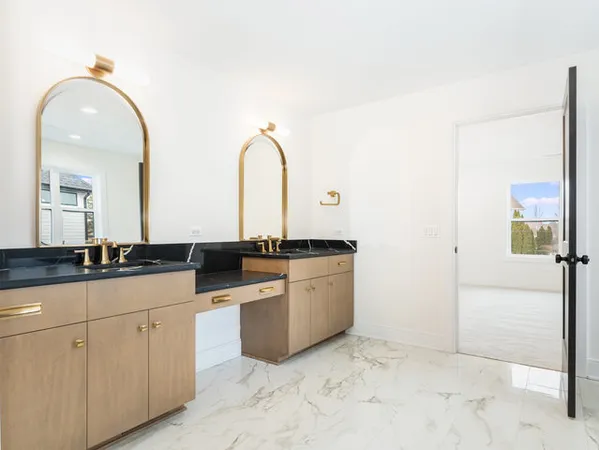 a hall with a sink and cabinets