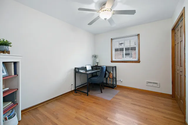 a view of a workspace with furniture and a workspace