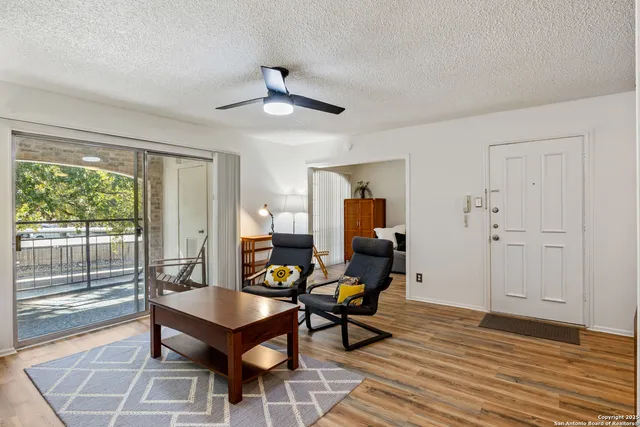 a living room with furniture and a window