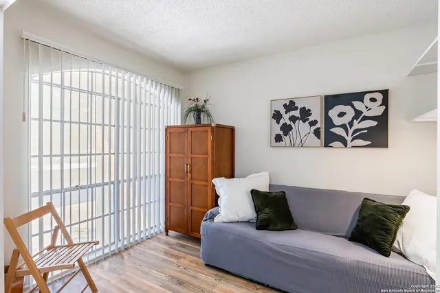a living room with furniture and a window