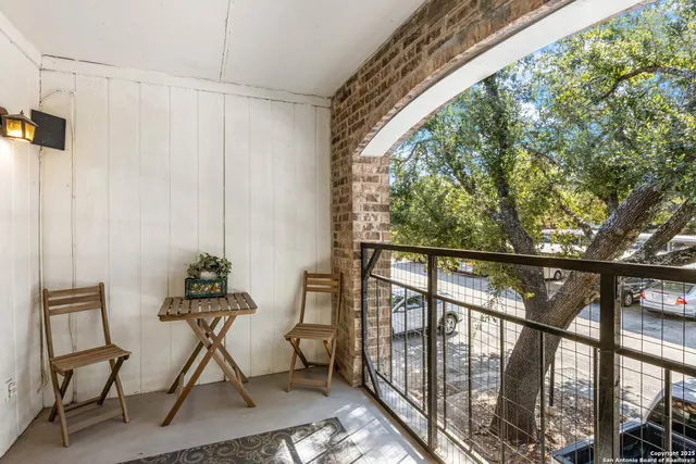 a view of a porch with furniture and the window
