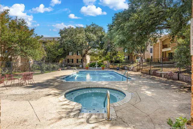 a view of outdoor space with swimming pool and patio