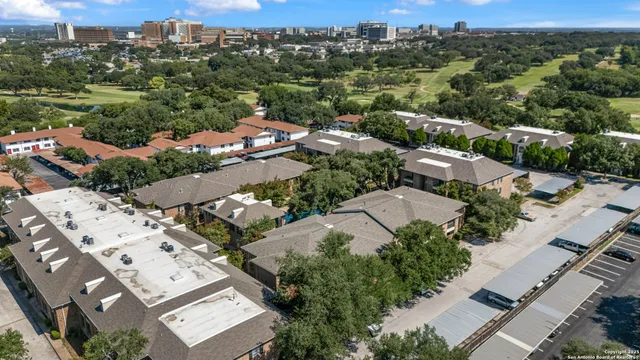 an aerial view of a city with lots of residential buildings