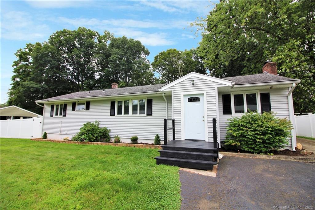 418 4th Ridge Road Wallingford, CT 06492 - Photo 1 of 1 a front view of a house with a garden