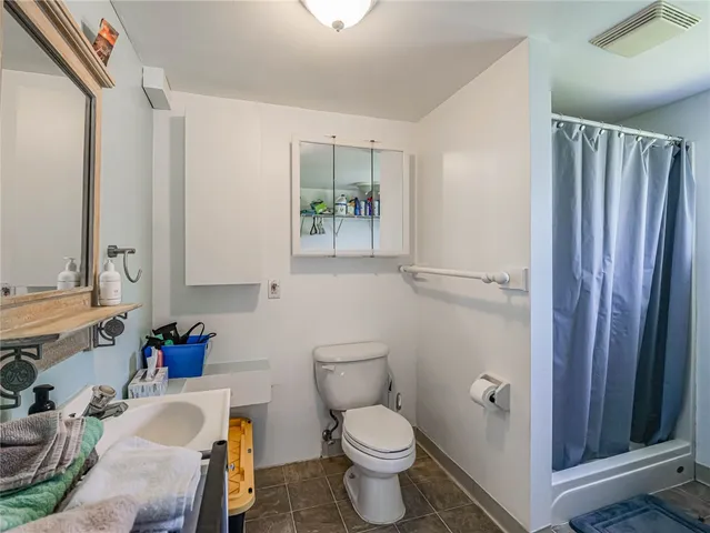 a bathroom with a sink toilet and vanity