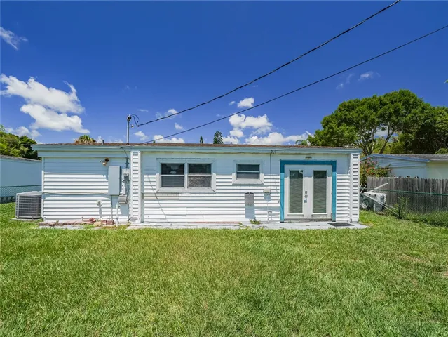 a front view of house with yard and outdoor seating