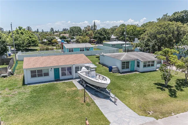an aerial view of a house with a garden