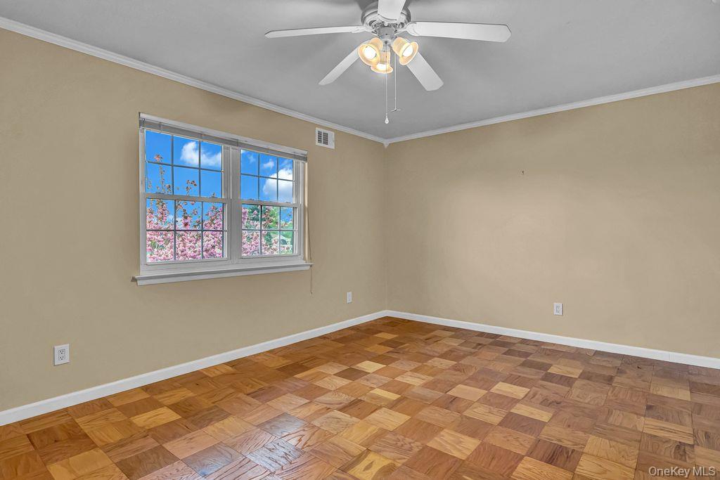 311 Mariners Way Copiague, NY 11726 - Photo 12 of 21 a view of an empty room with a window